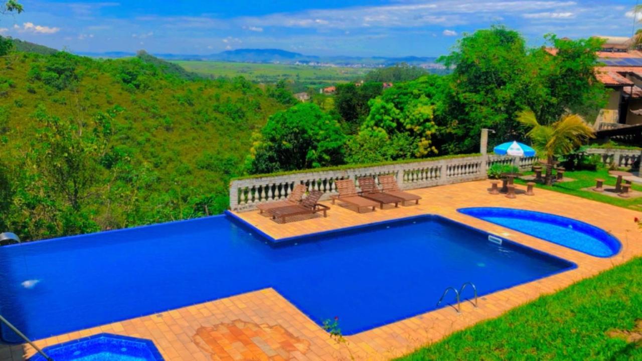 Pousada Nossa Senhora Penedo  Esterno foto View of the swimming pool at the hotel
