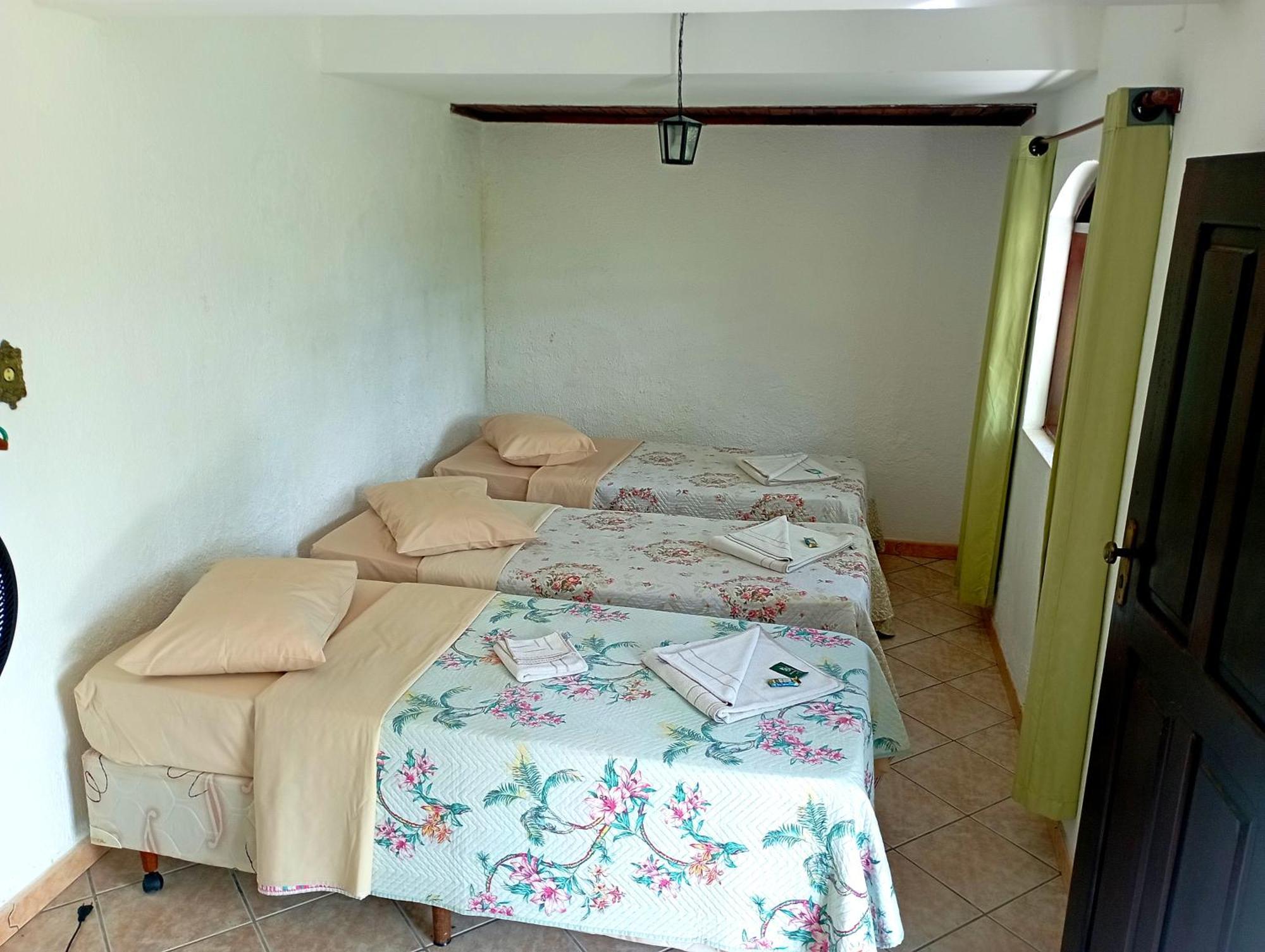 Pousada Nossa Senhora Penedo  Esterno foto A bedroom in a hostel