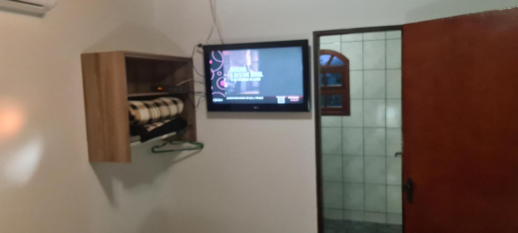 Pousada Nossa Senhora Penedo  Camera foto A television set in a hotel room