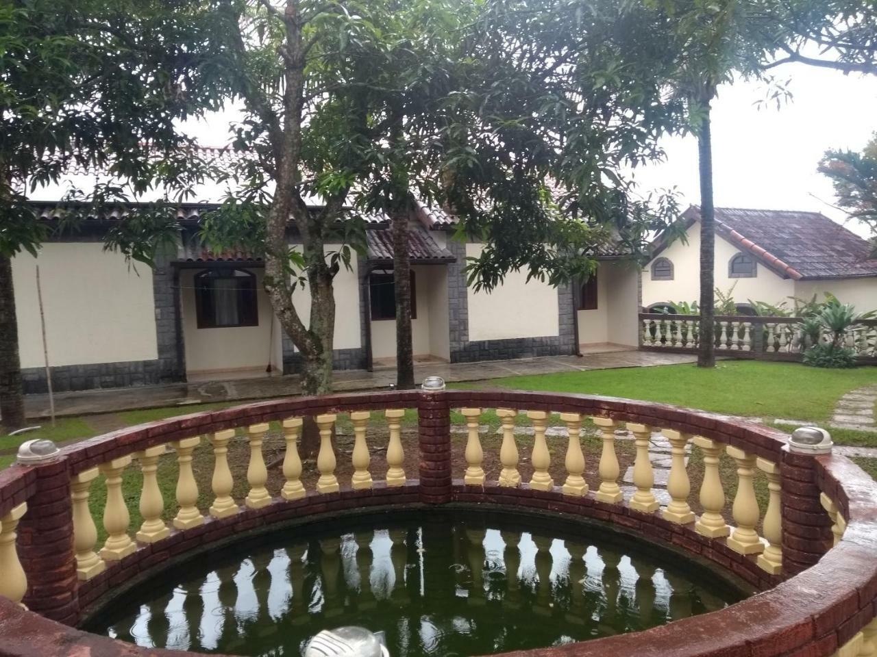 Pousada Nossa Senhora Penedo  Esterno foto The fountain at the front of the house